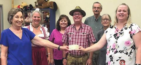 On hand as a check was presented by the Lions Club as sponsorship of the Das ist Lustig performance at the Schulenburg Public Library were (from left) Diana Mikesky, president of the Friends of the Schulenburg Public Library; Valina Polka of Das ist Lustig; Donna Holub, librarian; Ross Polka of Das ist Lustig; Thadious Polasek, library director; Cindy Lytle, librarian; and Kristi McBride, president of Schulenburg Lions Club.