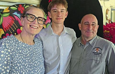 Jamison Bennett (center), scholarship winner, along with his mother Maura Bennett (left) and his father Stephen Bennett (right).