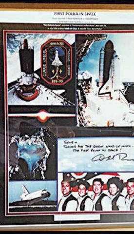 Photos given to Gene Hackemack including a photo of the astronauts. The handwritten note reads: “Gene – Thanks for the great wake-up music. The first polka in space!”