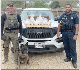Officers shown with the seized methamphetamine are Interdiction Sgt. Randy Thumann (left) with K-9 partner, Kolt, and Schulenburg Police Officer Byron Powe (right).