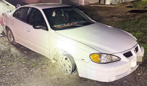 The vehicle, minus front tires, that was eventually stopped by tire deflation devices after a high-speed pursuit.