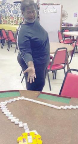 SHOWING OFF HER Mexican Train dominoes at the NVCC Senior Center is Alfreda Ellison
