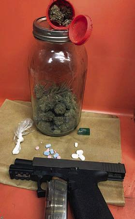 Pictured are the drugs and a weapon that were recovered by the SPD from a traffic stop on I-10 on Aug. 8.