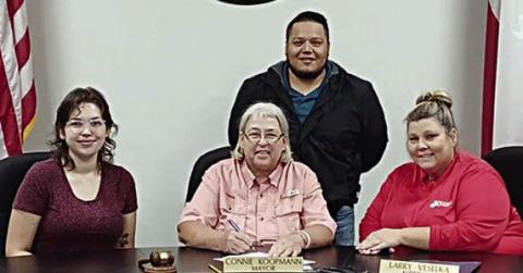 A proclamation recognizing the contributions of the Parents As Teachers program was signed by Schulenburg Mayor Connie Koopmann. On hand were (front row, from left) Dallas Garza, PAT parent educator; Mayor Koopmann; Karen Hoskins, PAT program director; and (back) Josue Rivas, PAT program developer.