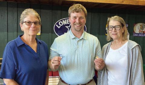 Year pins were presented to Mary Krupala (left), 60-year pin, and. Mary K. Seifert (right),70-year pin, by agent Kyle Hartmann (center).