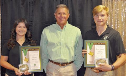 Gold Star AWARD – (from left) Mackenzie Poncik, presenter Commissioner Harvey Berckenhoff and Austin Nedbalek.