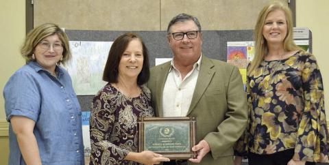 Darlene and Bob Stryk (center) accept the Fayette County Soil and Water Conservation District Conservation Rancher award. Making the presentation at last month’s banquet were Jessica Montez (left) of Fayette Electric Cooperative and Sherry Pfluger (right) of Round Top State Bank.