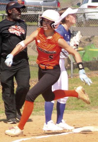Kinley Tillery flies around third base on her inside-the-park home run in the bottom of the first inning against Snook. Sticker Photo By Darrell Vyvjala