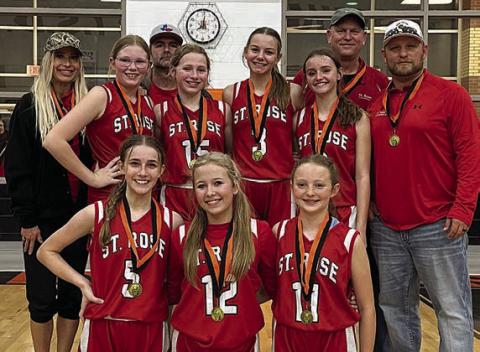 The St. Rose girls’ “A” team defeated La Grange, Bellville, and Shiner St. Ludmila to win the championship of the eight-grade division of Schulenburg ISD’s junior high tournament on Jan. 13. Team members were: (front, from left) Jenna Guentert, Layney Conner, Caroline Bartek; (back, from left) coach Alex Voskamp, Ashtyn Schaefer, coach Matt Bonner, Saybra Pinney, Layne Besetzny, Miranda Bonner, coach Shane Hollas, and coach Ian Voskamp.