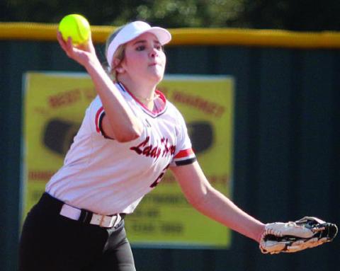 Lady Horn second baseman Audrey Woytek throws to first for an out against Episcopal. Sticker Photo By Darrell Vyvjala