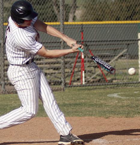Owen Brenek connects for an RBI-single on Friday. Sticker Photo By Darrell Vyvjala