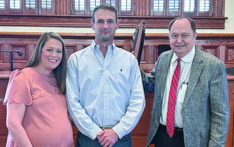 Newly-appointed Place 2 Commissioner Clint Sternadel (center) is shown with his wife, Kristie, and Fayette County Judge Dan Mueller.