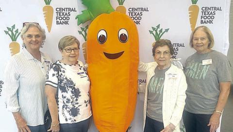 Attendees from Fayette County at the Central Texas Food Bank conference were (from left) Debra Blansitt, Schulenburg Area Food Pantry; Pam Cunningham, Flatonia Area Food Pantry; “Rooty,” the Food Bank’s mascot; and Mary Vacek, and Linda Oltmann, both of AMEN in La Grange.