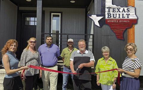 Representatives from Texas Built Motile Homes and the Schulenburg Chamber of Commerce shown at the ribbon cutting are (from left) Sara Robbins, office manager; Tammy Treybig, representing the Schulenburg Chamber of Commerce; Skylar Thompson, sales manager; Bryan Stacy, housing consultant; Tom Schadler, general manager; Nina Howard, representing the Schulenburg Chamber of Commerce; and Diana Mikesky, Schulenburg Chamber board president.