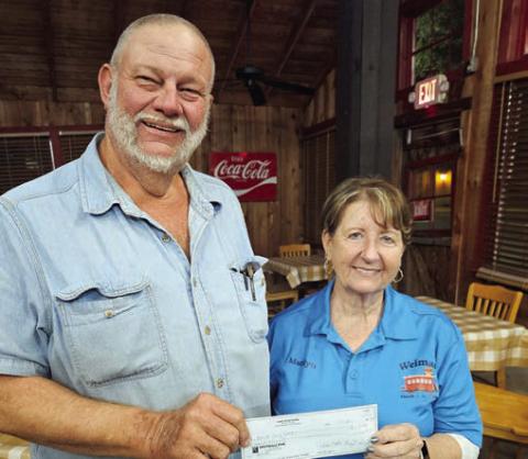 A donation to Colorado County EMS was made by Hermann Sons Life Lodge 14. Marilyn Hinze accepted the check on behalf of Colorado County EMS from Ed Moeller, president, representing Lodge 14.