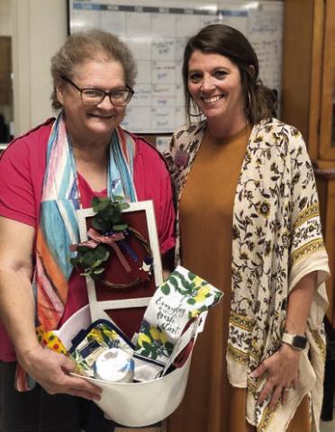 Bingo – Kathy Besetzny (left) made up for lost time and won many bingo games including the blackout prize. Also shown is Chyna Podhajsky (right), bingo caller from Hallettsville Nursing &amp; Rehabilitation Center.