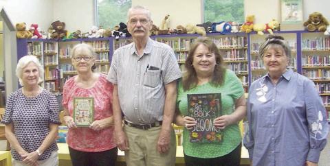 Garden Club donates books to library