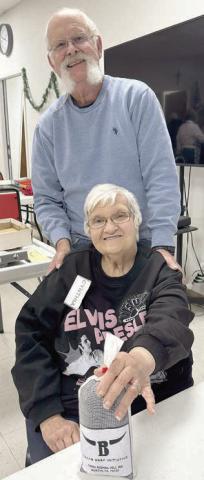 Bingo – Rusty Beckmann (back), member and board member, calls bingo games to finish out the day on Wednesdays. Cynthia Meyer (front), holds her blackout prize of two pounds of ground beef from Texas Beef Initiative.