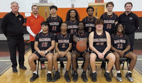 Seated, from left: Trey Silcox, Jakaden Houston, Dekendrick King, Hayes Baumgarten, and M’Kai Wilson. Standing, from left: head coach Richard Hoogendoorn, assistant coach Jordan Hafley, Justin Curtis, Keigan Johnson, Devin Wilson, Parker Kahn, and assistant coach Aaron Rowlett. Sticker Photo By Darrell Vyvjala
