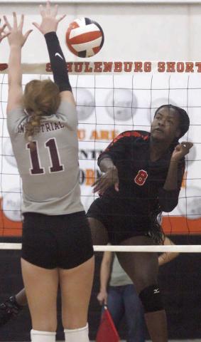 Jessalyn Gipson gets a kill off an Industrial block in the first set last Thursday. Sticker Photo By Darrell Vyvjala