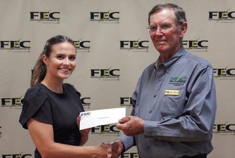 Turtle Wing Foundation received a $7,500 grant from FEC and CoBank. Shown are (from left) Turtle Wing Foundation executive director Destiny Psencik and FEC board president David Lehmann.