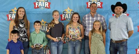 Overall High Point Buckles – (from left) Lukas Bartos and Megan Bartos, representing the Andrew Srubar  family; Crockett Guenther, junior division winner; Madison Markwardt, intermediate division winner; Avery Nelius, senior division winner; and Kevin Bartos, Hannah  Bartos and David Srubar, representing the Andrew Srubar family. The Bartos family is from Schulenburg and Srubar lives in Cypress.