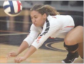 Kieryn Adams lunges to save a short Lago Vista serve from hitting the floor in the second set. Sticker Photo By Darrell Vyvjala