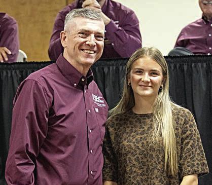 Sophie Vinklarek (right), graduate of Smithville High School, was selected to receive Fayette Electric Cooperative’s “luck of the draw” scholarship. Vinklarek was congratulated by FEC general manager and CEO Doug Lambert (left).