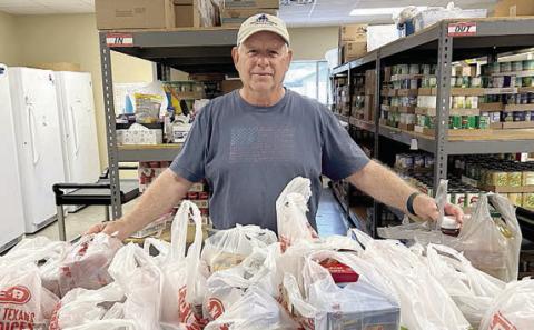 The Swiss Alp United Evangelical Lutheran Church congregation, along with Pastor Lemae Higgs, has donated 87 pounds of non-perishable food plus $100 to the Schulenburg Area Food Pantry. This was the church’s Lenten Wood Drive. Jack Niesner, pantry vice president, is shown delivering the food items to the pantry.
