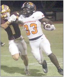 Rodney H Walton stiff-arms a Bulldog to get free for a 39yard run in the first quarter. Sticker Photo By Darrell Vyvjala
