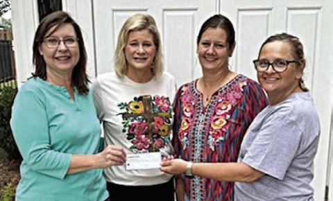 St. Anne’s Society presents donations