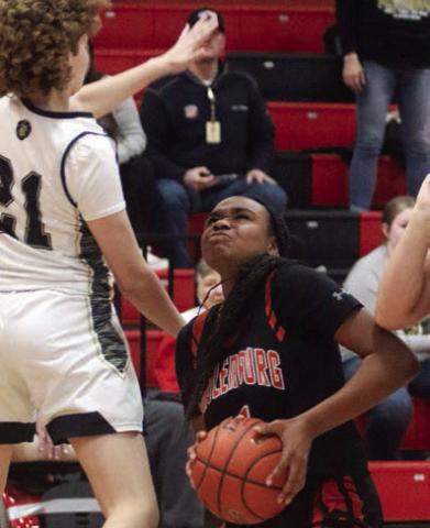 Jashiya Jackson gets by a Lady Panther for a bucket in the fourth quarter. Sticker Photo By Darrell Vyvjala