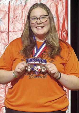 Cora Brenek shows off her state medal.