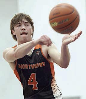 Jayse Janda dishes to a teammate in the fourth quarter. Photo By Ricky Toro