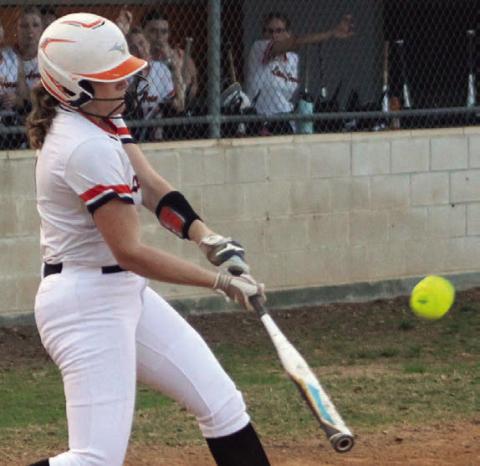 Hailey Kahlden connects for the first of her three hits Friday, driving in a run in the bottom of the first inning. Sticker Photo By Darrell Vyvjala