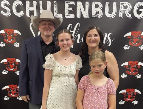 New SISD Athletic Director Clay Ferguson (left) is shown with his wife, Stephanie (back, right), and two daughters – 12-year-old Paisley (front, left) and 9-year-old Hadley (front, right) – following the Board of Trustees’ unanimous vote on his hiring last Friday. Sticker Photo By Darrell Vyvjala