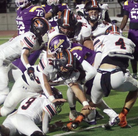 Bringing down Caden Judie for a loss of 3 in the second quarter are Jayse Janda (No. 4), Aidan Mendez (No. 44), Adin Beyer (No. 9), Nick Goode (No. 11, Marshall Wellborn (No. 70), and Preston Kahn (No. 50). Sticker Photo By Layne Vyvjala