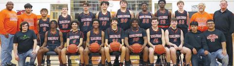 This photo of the 2020-21 Shorthorn basketball team members, coaches, and managers appeared atop the front page of the March 18 issue after they reached the Class 2A state semifinals.