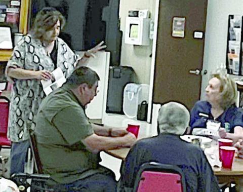 Guest Speaker – Kelly Franke (standing at back left), director of the Combined Community Action office, was the lunch-and-learn speaker on Monday, Oct. 9 at Senior Connections.