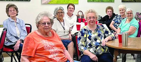 Several members are shown getting ready for lunch at the Senior Connections Center. Lunch is served each Monday and Wednesday, with a chef’s choice light lunch on Friday.
