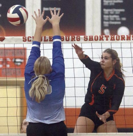 Haylee Vacek knocks a kill cross-court in the third set against Rice Consolidated. Sticker Photo By Darrell Vyvjala