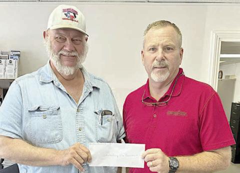 A donation was made by Hermann Sons Life Lodge 14 to the Schulenburg Volunteer Fire Department in observance of Make A Difference Day in October, with the motion approved at the meeting on Aug. 9. President Ed Moeller (left) represented Lodge 14 in presenting a check for $500 to Jeff Proske (right), Schulenburg Volunteer Fire Department chief.