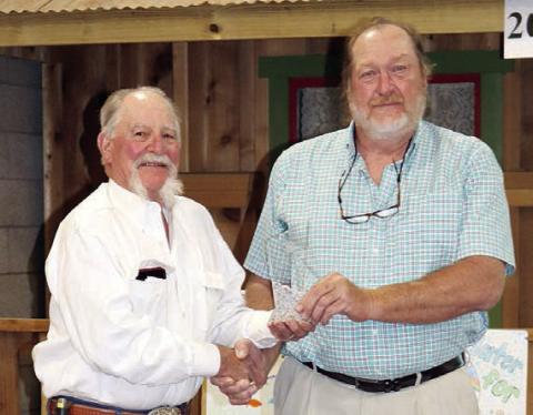 The 2022 Hugh Hammond Bennett Regional Conservation Planner of the Year Award was presented to Glen Minzenmeyer (right) at the Area 3 Conservation Awards Banquet by Rick Schilling (left), State Area 3 board member on the Association of Texas Soil &amp; Water Conservation Districts.