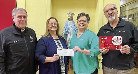 On hand as Fayette Savings Bank presented a check to St. Rose School through its School Spirit Debit Card Program were (from left) Rev. Jasper Liggio, St. Rose of Lima Catholic Church pastor; Rosanne Gallia, St. Rose School principal; and Cheryl Brossmann and Mike Olle, representing Fayette Savings Bank.