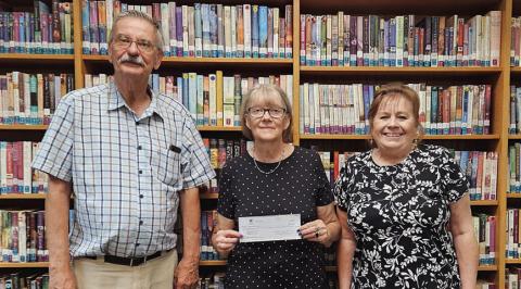 Displaying a $10,000 grant from the Tocker Foundation are Schulenburg Public Library personnel (from left) Thadious Polasek, director; Cindy Lytle, librarian; and Donna Holub, assistant librarian.