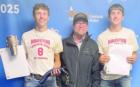 Van Prihoda (left) and Koi Prihoda (right) of Schulenburg both caught calves at the calf scramble held on Tuesday March 11 during the Houston Livestock Show & Rodeo. Van Prihoda was the second contestant to catch a calf that night and also won the “mystery calf.” A total of 30 contestants competed in the event, with only 15 catching calves. They are shown with Schulenburg ISD ag teacher/FFA advisor Brad Lux (center).