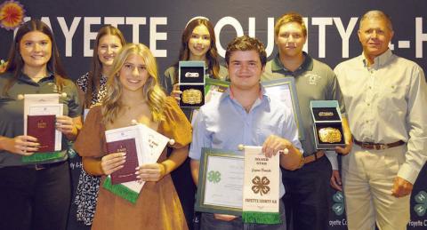 Senior Division Awards – (front row, from left) Addison Faske, “I Dare You” Award; Logan Poncik, Silver Star  Award; (back row) Madeline Willrich, “I Dare You” Award; Elena Supak, Silver Star Award; Tori Newton, Gold Star Award;  Railey Nieto, Gold Star Award; and presenter Commissioner Harvey Berckenhoff.