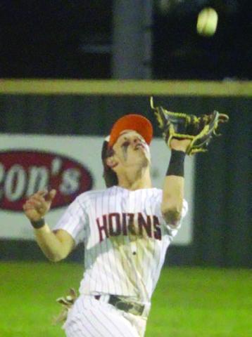 Cooper Demel tracks a high infield popup into his glove against Flatonia. Sticker Photo By Darrell Vyvjala