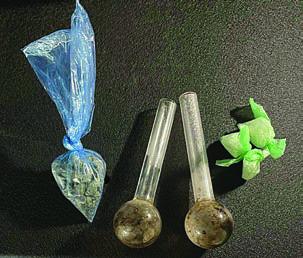 Shown above are the drugs and meth pipes found by SPD officers during a vehicle search Friday morning.