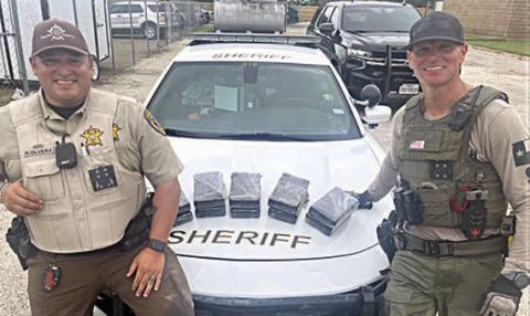 Ten bundles of coc aine were located during a traffic stop on Interstate 10 near Flatonia conducted by Drug Interdiction Investigator David Smith (right), who was assisted by Deputy Herman Olvera.